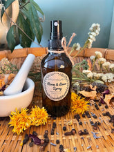 Load image into Gallery viewer, Room &amp; Linen Spray bottle surrounded by natural elements on a woven surface