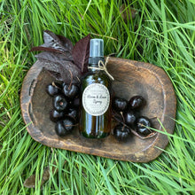 Load image into Gallery viewer, Dark Cherry Orchard room &amp; linen spray on a wooden tray with dark cherries surrounding the bottle.